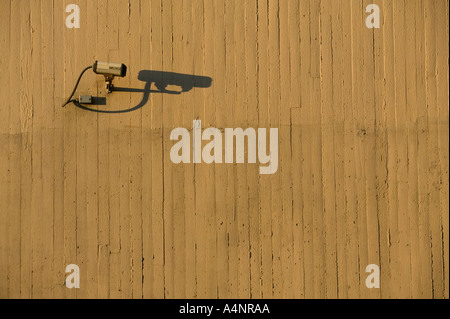 A CCTV camera fixed to an outdoor cement wall April 2005 USA Stock Photo