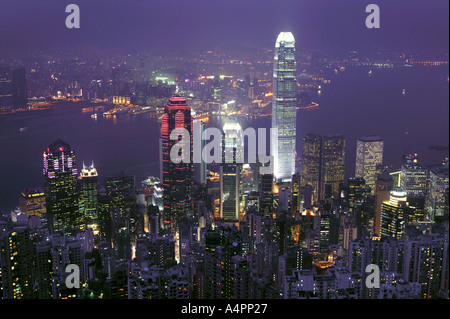 Hong Kong Skyline at Night with dominating IFC tower in the central district overlooking harbour from victoria peak China