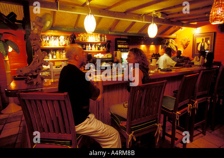 Couple sitting at a bar in Rodney Bay St Lucia Stock Photo