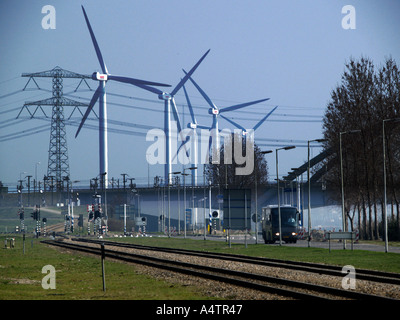 A row of wind turbines in the industrial area of the port of Rotterdam the Netherlands Stock Photo