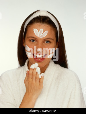 woman creaming face Stock Photo - Alamy