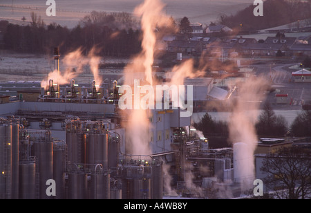 Pollution smoke rising from factory chimneys from an industrail chemical site polluting the enviroment Scotland UK Stock Photo