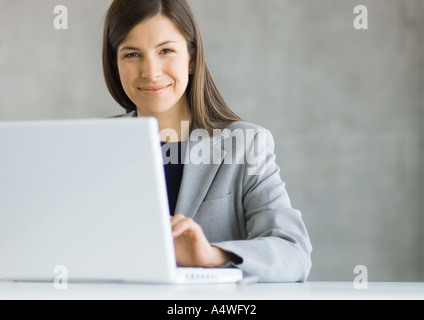 Businesswoman using laptop computer Stock Photo