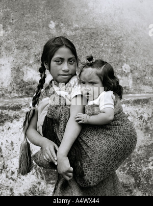 Child siblings native American Indians in San Cristobal De Las Casas in Chiapas in Mexico in Latin Central America. Childhood Portrait Travel Stock Photo