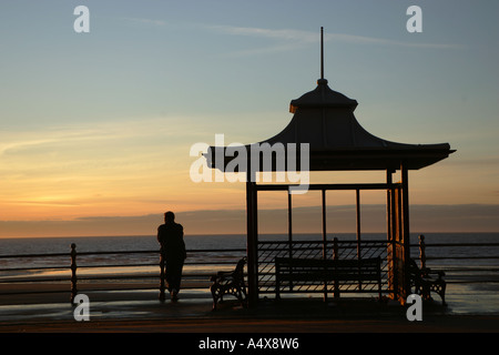 Silhouette of a Blackpool tram stop at dusk Stock Photo