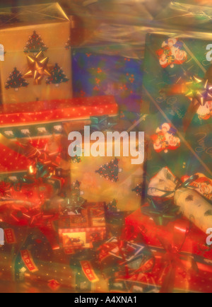 Giftboxes wrapped with red ribbons on green and blue background. 3D ...
