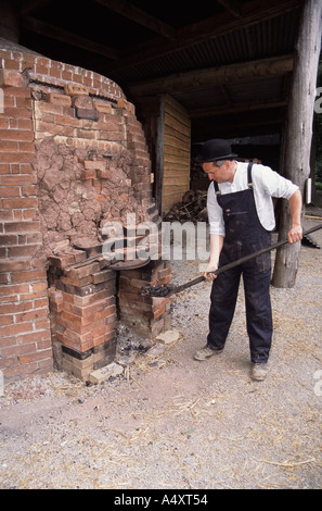 Colin Richards making bricks by hand setting the fie in the kiln Stock Photo