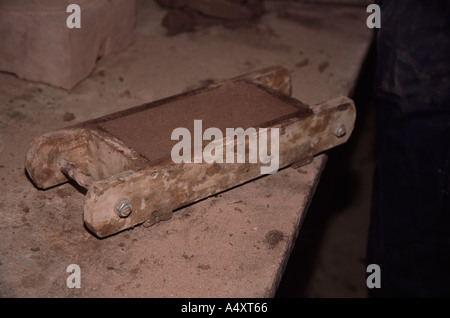 Colin Richards making bricks by hand using a mould to shape it. Stock Photo
