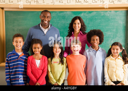 Portrait of teachers and students in classroom Stock Photo