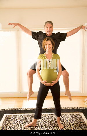 Pregnant couple acting silly Stock Photo