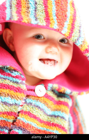 Baby Girl In Colourful Fleece Hooded Poncho Against A White Background Scotland 05 Stock Photo Alamy
