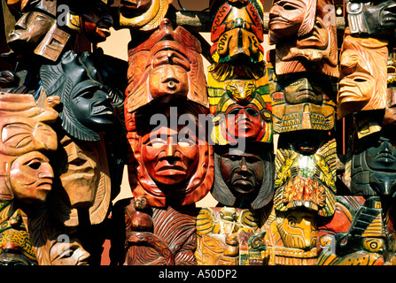 Mayan handcrafted wooden masks used for traditional dancing on sale at the weekly market of Chichicastenango in Guatemala. Stock Photo