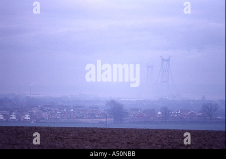 The Humber bridge in mist from the south side of Barton town on the south Humber bank Stock Photo