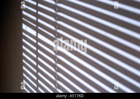 shadow of blinds cast on wall Stock Photo