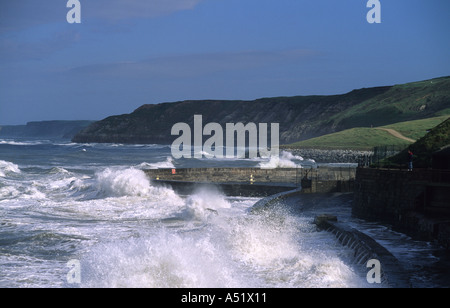 giant waves crashing over sea defences at the spa scarborough during storm yorkshire uk Stock Photo