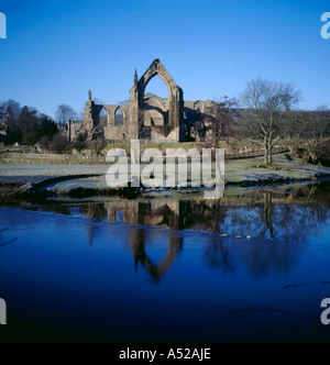 Ruins of Bolton Priory seen over River Wharfe in winter, Wharfedale, Yorkshire Dales National Park, North Yorkshire, England, UK Stock Photo