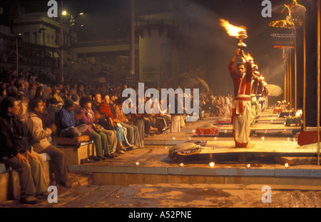 Hindu priests performing the Deepmala Ceremony at a Ghat on the banks of the river Ganges in Varanasi India Stock Photo