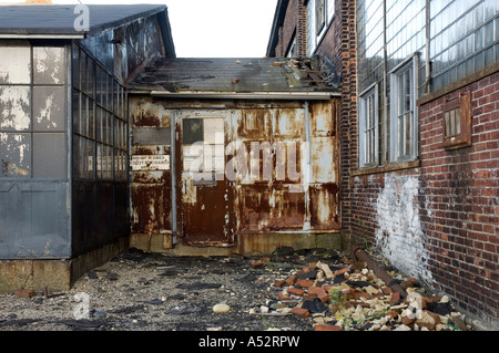 Detail of some adjoined and disused buildings at a railyard; full description below. Stock Photo