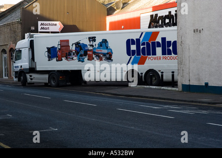 Large articulated lorry parked outside a local DIY 'hardware store delivering goods in Dundee, UK Stock Photo