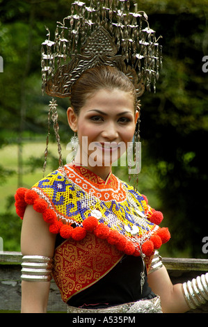 Iban woman in traditional costume in a traditional Iban house at the ...