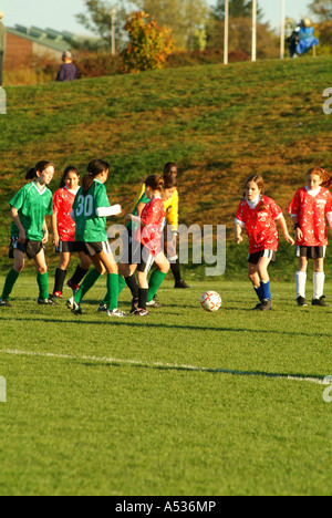 Junior Varsity middle school girls play soccer on a soccer park field Stock Photo
