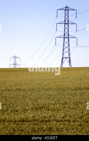 British pylon in farmers field UK showing our carbon footprint with electricity power pylon in field UK Stock Photo