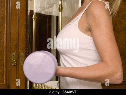 young woman working out with weights Stock Photo