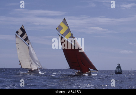 Old sailing workboats racing Falmouth England UK Stock Photo