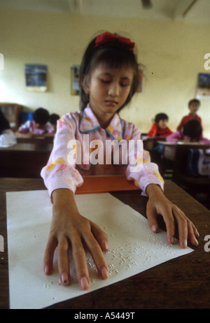 Painet ha2612 5465 vietnam schools blind girl reading braille hanoi country developing nation less economically developed Stock Photo