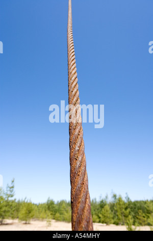 Rusty steel rope against blue sky Stock Photo