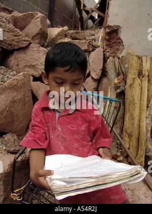 Painet ip1844 honduras boy doing schoolwork home tegucigalpa country developing nation less economically developed culture Stock Photo