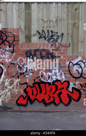 Random graffiti and tags on brick wall in Swindon Wiltshire Stock Photo