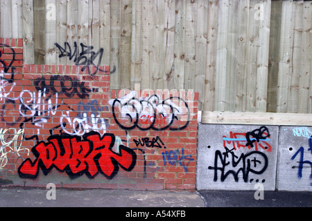 Random graffiti and tags on brick wall in Swindon Wiltshire Stock Photo