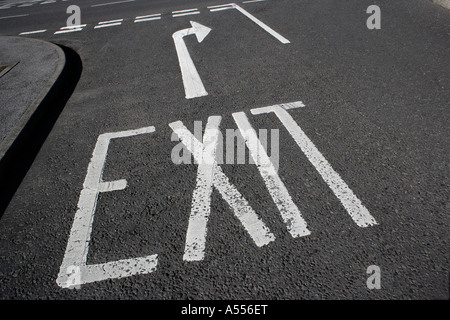 Exit sign painted on tarmac Stock Photo