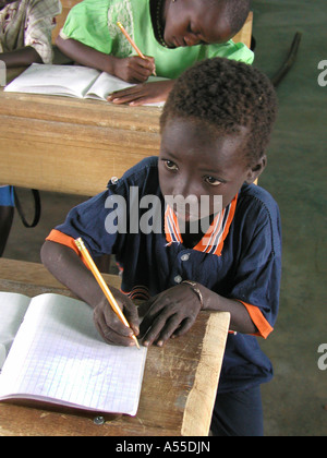 Painet ik0317 burkina faso boy writing school provided by crs fada country developing nation less economically developed Stock Photo