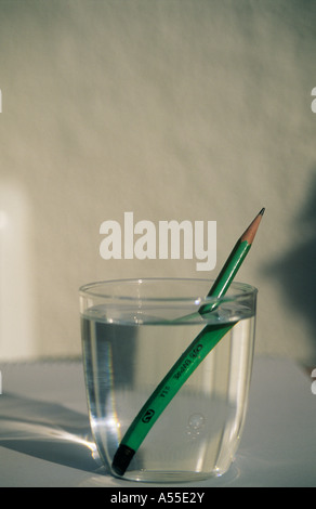 pencil in glass of water, showing refraction Stock Photo