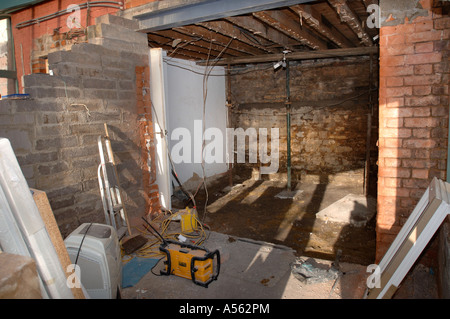 BUILDING WORK ALLOWING THE ENLARGEMENT OF A WALL OPENING INTO A CONSERVATORY AREA Stock Photo