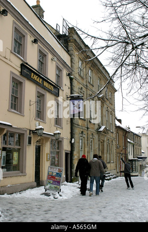 Youths walking in the snow in Witney Oxfordshire England. Stock Photo