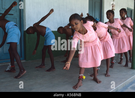 India boys and girls do traditional Hindu exercises in the school yard Stock Photo