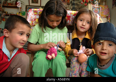 Painet iy8310 children kids colombia sisters playing dolls slum altos cazuca bogota photo 2005 country developing nation Stock Photo