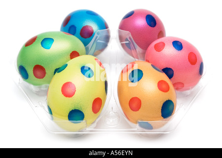 Six colorful eggs arranged on a white background. Stock Photo
