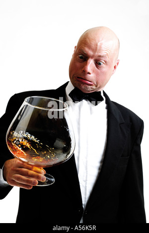 Man holding huge cognac glass Stock Photo