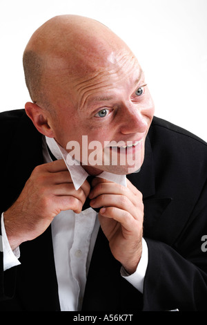 Man binding bow-tie, portrait Stock Photo