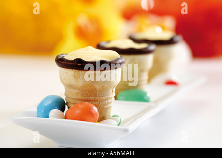 Waffle cups with cream in a row Stock Photo