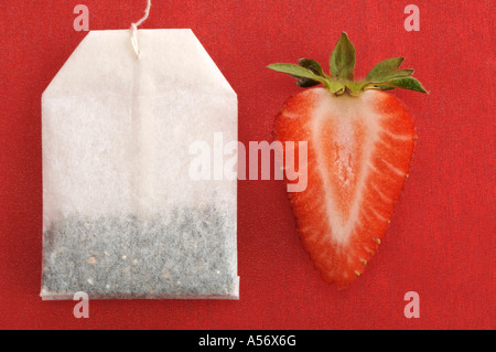 Sliced strawberry by tea bag Stock Photo