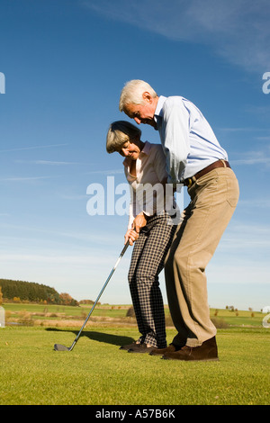 Germany, Bavaria, senior couple playing golf Stock Photo
