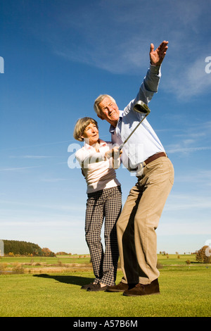 Germany, Bavaria, senior couple playing golf Stock Photo