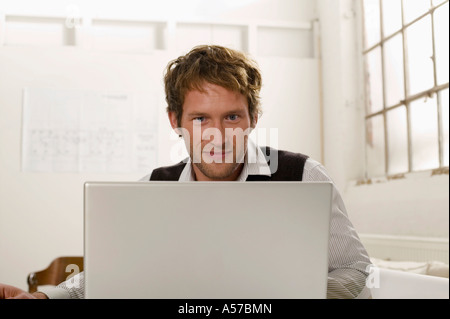 Young man working on laptop Stock Photo