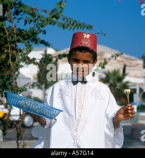 Young boy selling flowers, Hammamet, Tunisia, North Africa Stock Photo