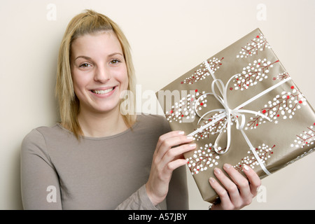 Young woman holding gift Stock Photo